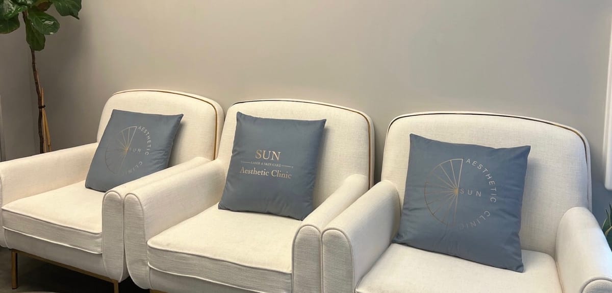 Sun Aesthetic Clinic lounge armchairs with branded pillows
